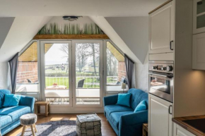Urlaub mit Ostseeblick, Schwimmbad, Sauna & direkte Strandlage in Kronsgaard